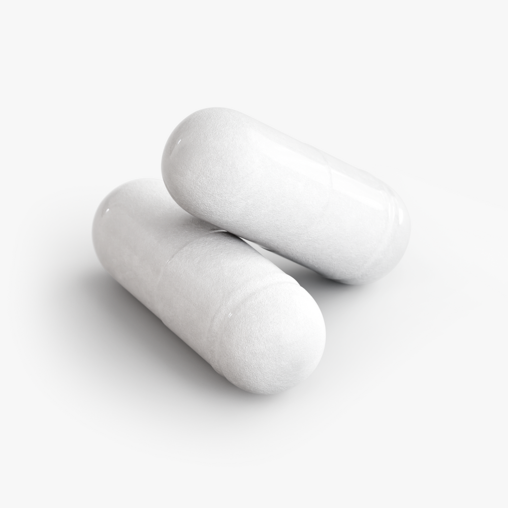 Close-up of two DP Probiotic 40 Billion capsules