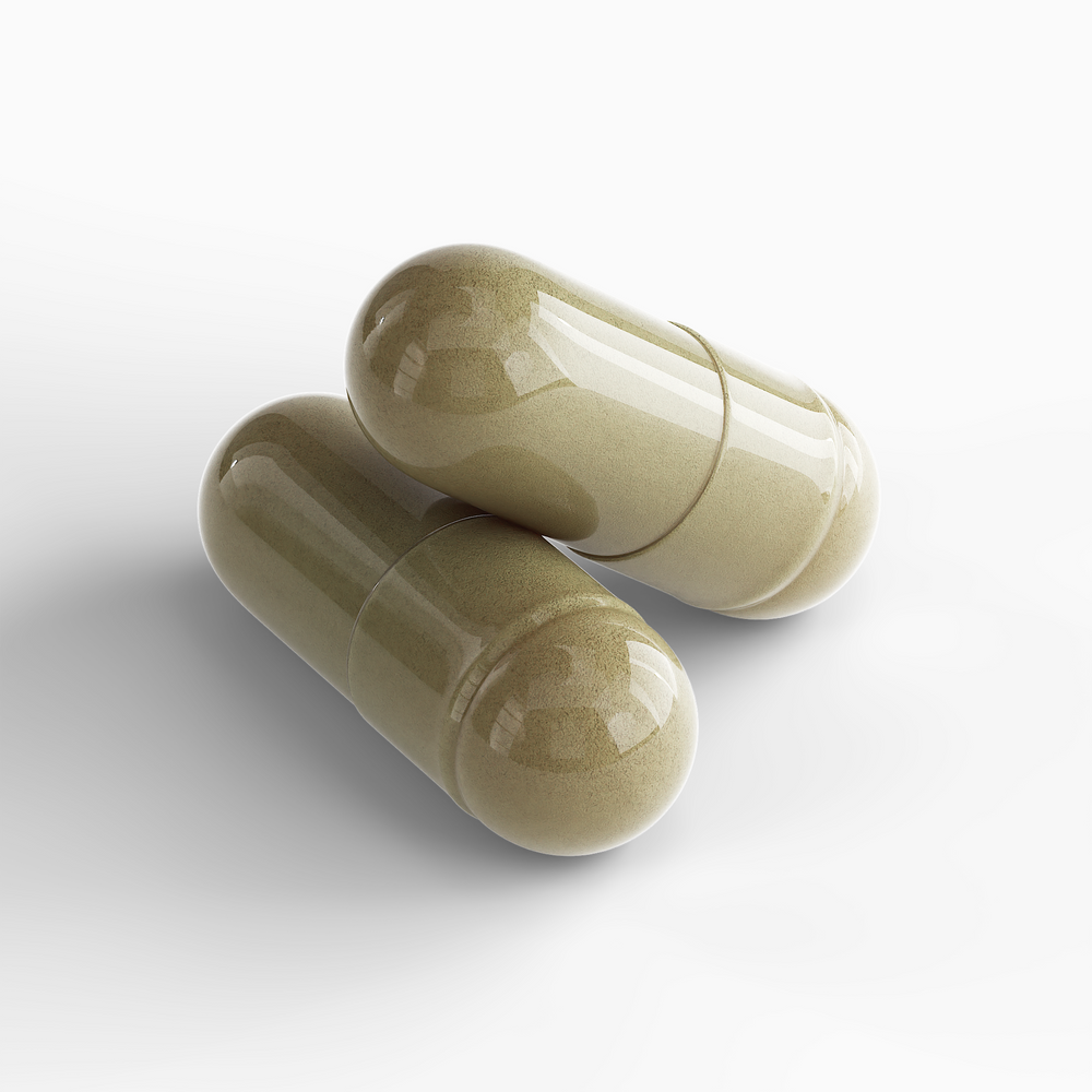 Close-up of two DP Women's Vitality Formula capsules